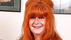 Aroused older woman with red hair on top of a younger man