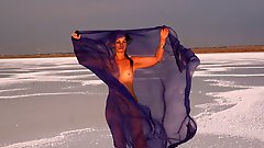 Beautiful sunset scenery by a shawl on a salt lake