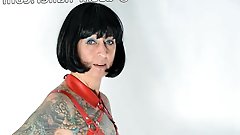Photo shoot with full body tattooed MILF Cleo